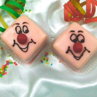 Punschkrapfen mit Clownsgesicht